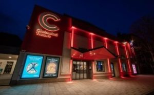 Exterior of Chelmsford Theatre lit up at night.